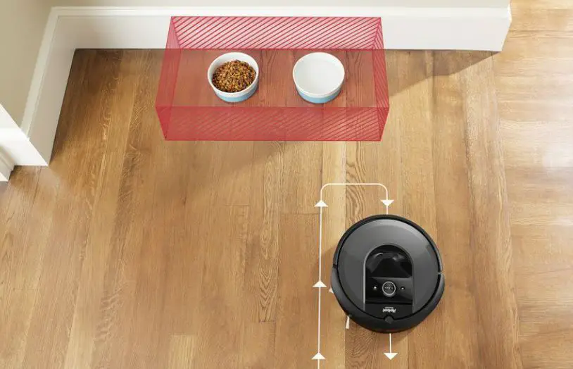 Roomba använder AI för att undvika hundskålar på ett golv.