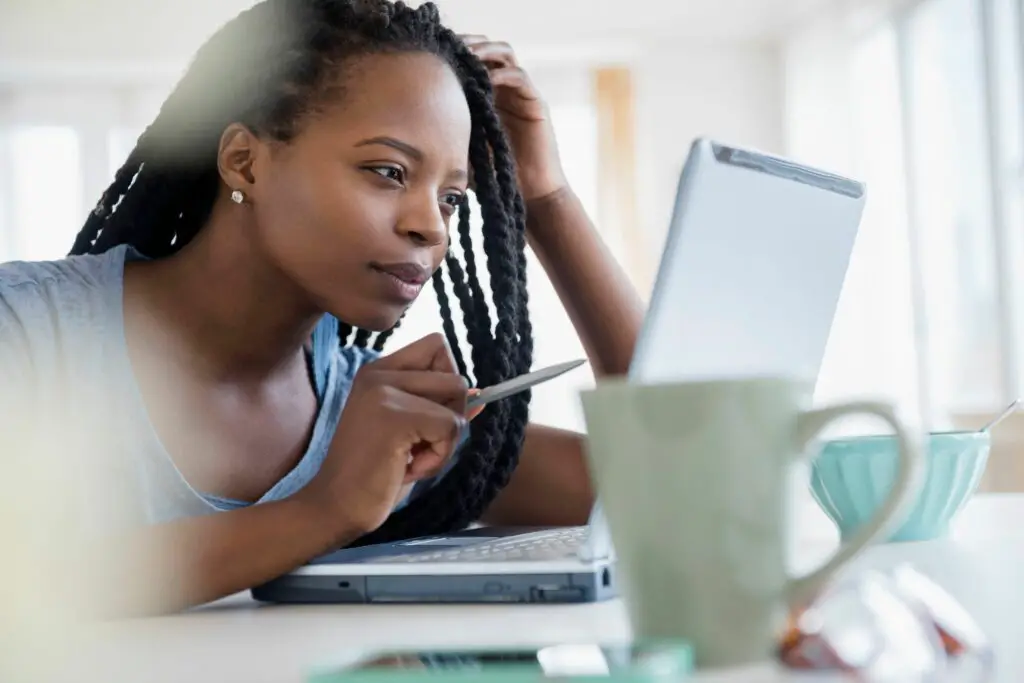 black woman using laptop 597314925 5b855405c9e77c0025dda6d9 3c70081fe44e40dfa46ffc269e937d80