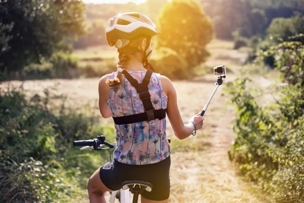 girl with helmet and a braid taking a selfie on a bicycle in a beautiful sunny day 825103938 5c4b7d6cc9e77c0001d75f98