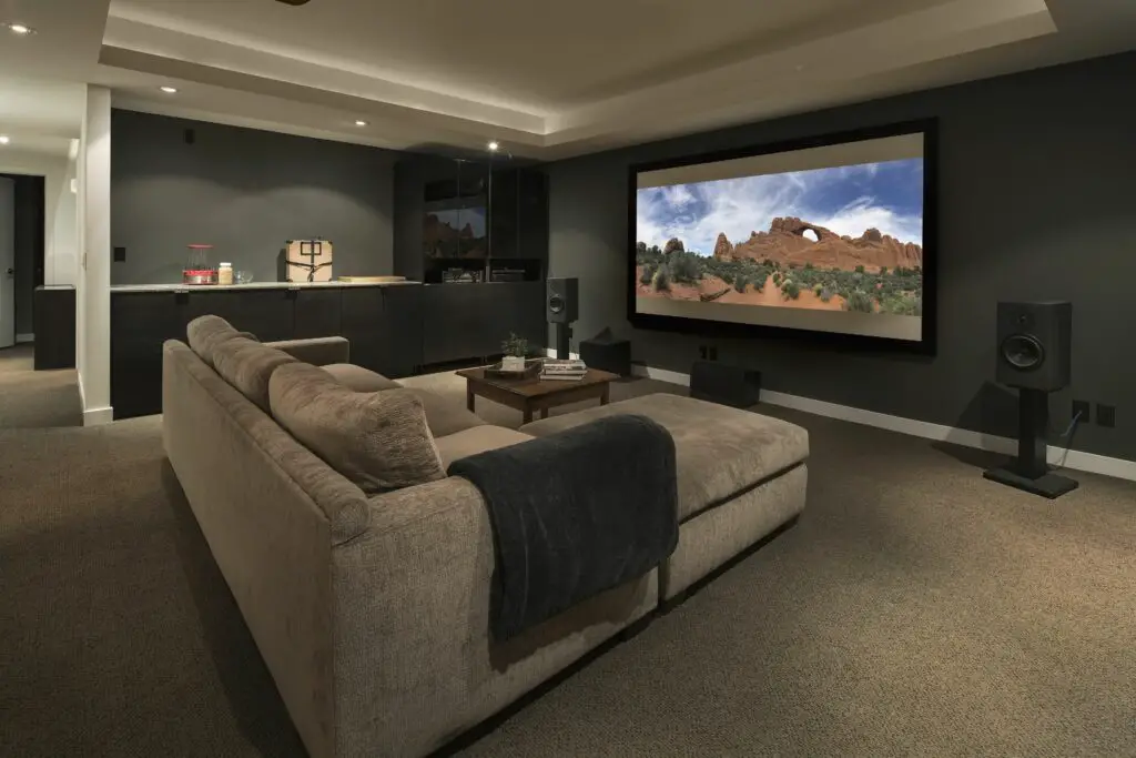 movie playing on projection screen in home theater 915093896 5bdb7eb0c9e77c0026d2970f