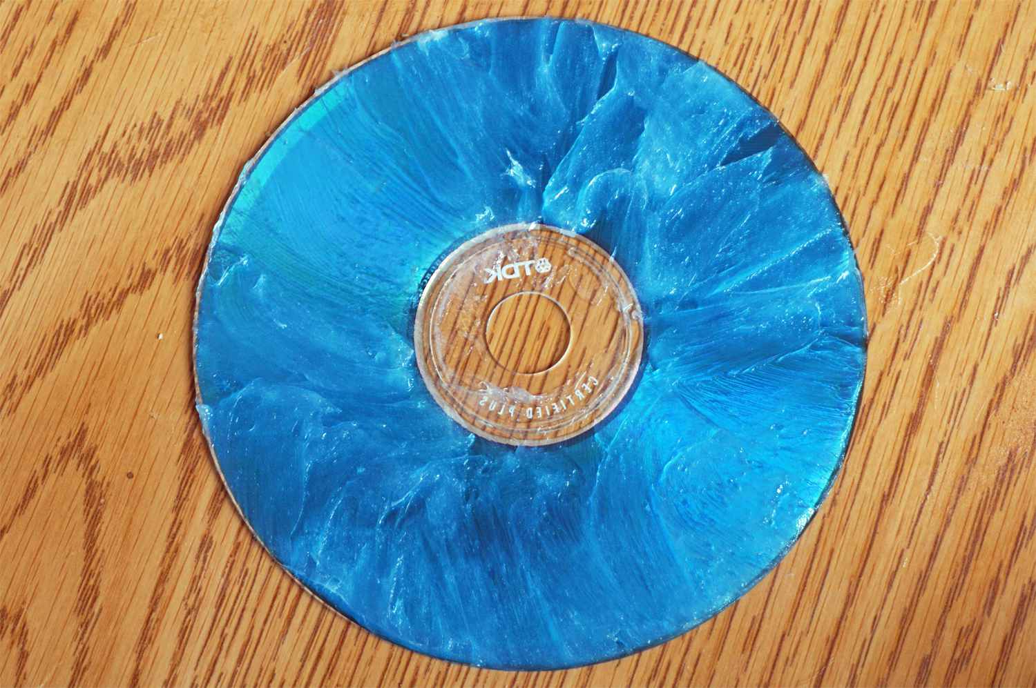 Skrapad CD täckt med vaxprodukt
