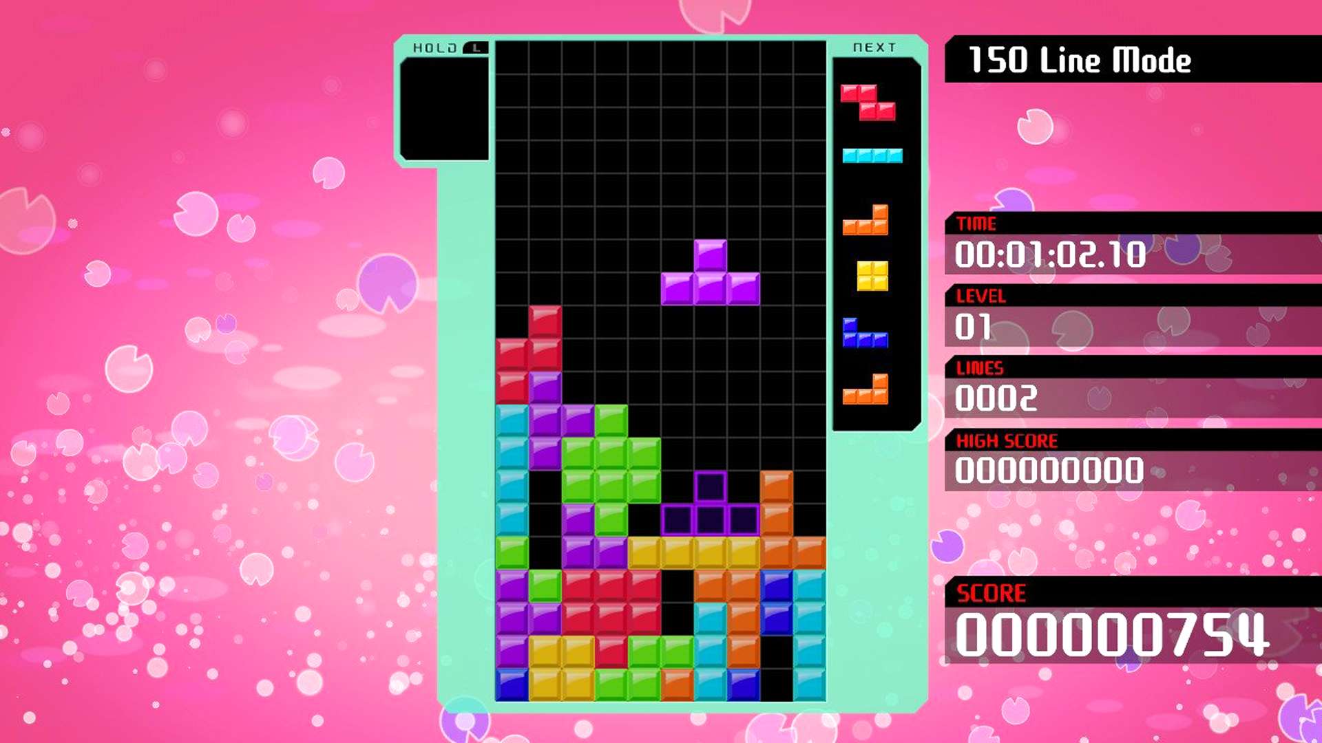 En T-block Tetromino i Tetris 99 på Nintendo Switch gör en T-spinn ..