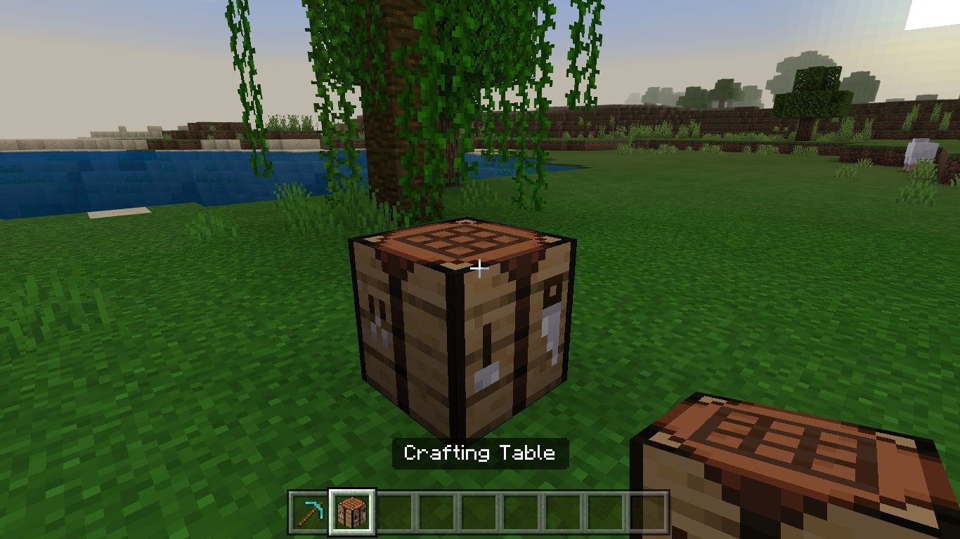 Ett hantverksbord på marken i Minecraft