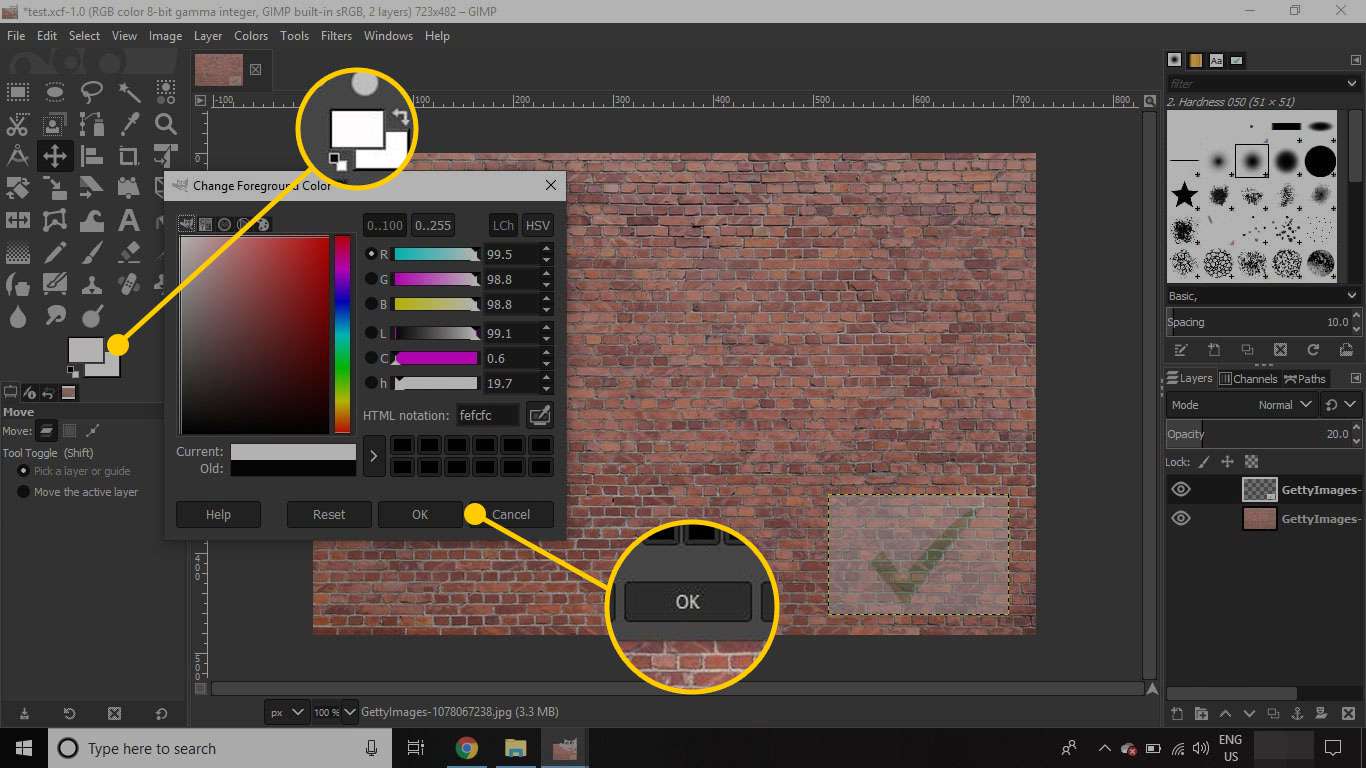 Välj en ny förgrundsfärg i GIMP.  Färgväljaren och OK -knappen är markerade