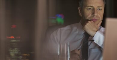 pensive businessman working late at laptop in office 500796897 5a84e2038e1b6e00367c08ca