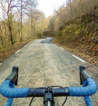 solo cyclist with blue handlebars in winter forest 653836842 5a2f08da89eacc0037a0e1c1 aa31864a593d4794b04d371f60f63e80