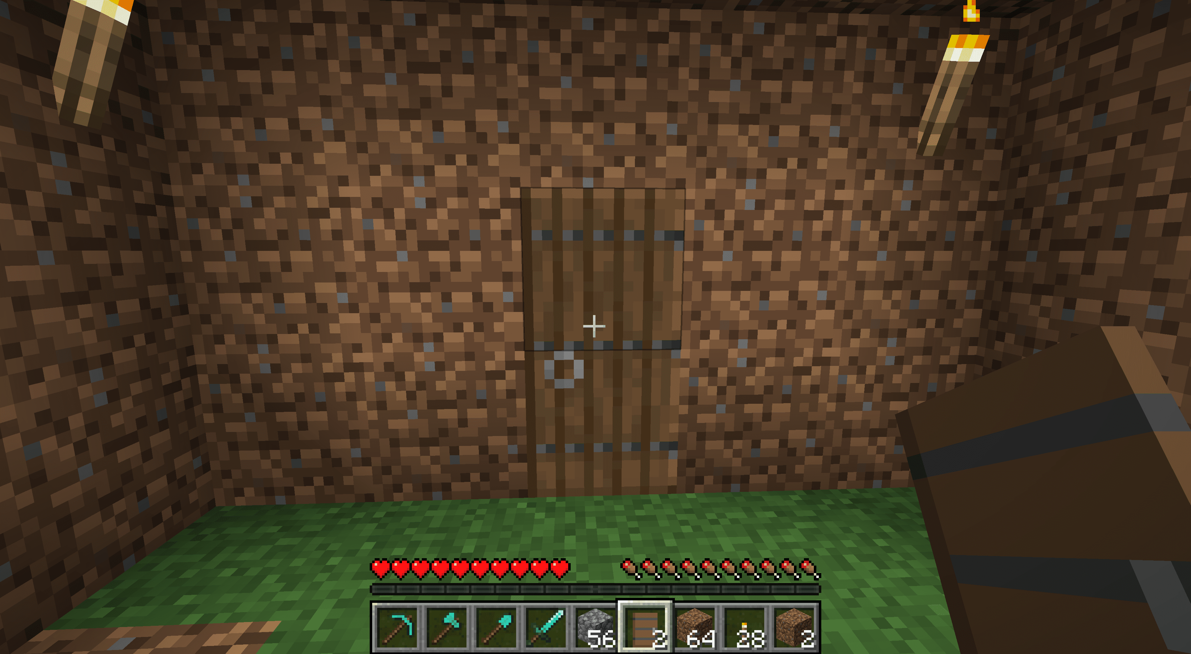 En dörr i ett smutsigt Minecraft -hus.